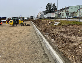 Úprava terénu, realizace zpevněných ploch, vnější kanalizace, vodovodu a oplocení - parkoviště spol. ADKO.