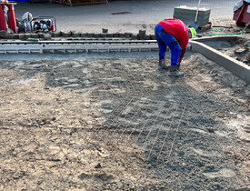 Úprava terénu, realizace zpevněných ploch, vnější kanalizace, vodovodu a oplocení - parkoviště spol. ADKO.